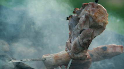 close up of a barbecue in smoke