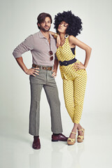Retro couple. An attractive young couple standing together in retro 70s clothing.