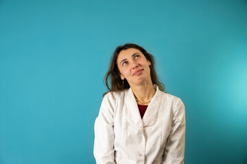 Female caucasian doctor dressed in uniform isolated on background. Smiling Caucasian medical doctor.