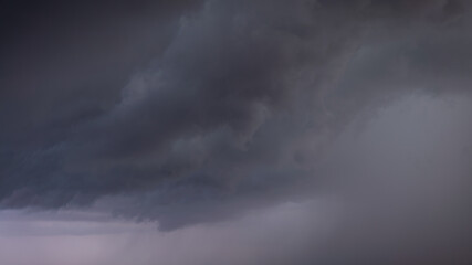 Fototapeta na wymiar Dark storm clouds make the sky in black. Rain is coming soon. Nature background.