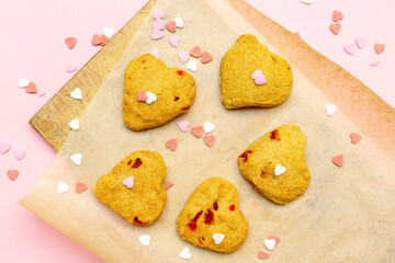 homemade heart shaped cookies with colorful sweet mini confetti, sprinkles, pastry bakery food. pink background for Valentines day, womens day, love, romance, party pattern