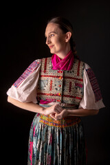 Young beautiful slovak woman in traditional dress. Slovak folklore