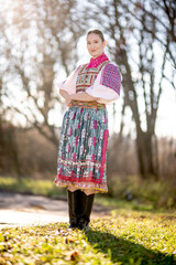 Young beautiful slovak woman in traditional dress. Slovak folklore