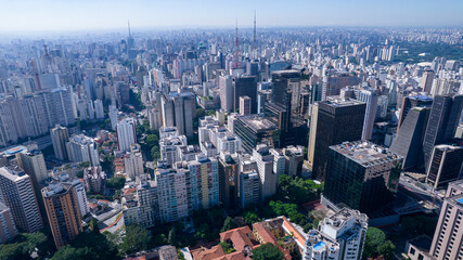 Fototapeta premium Aerial view of Av. Paulista in São Paulo, SP. Main avenue of the capital. With many radio antennas, commercial and residential buildings. Aerial view of the great city of São Paulo.