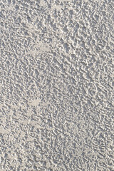 Textures on a white concrete wall