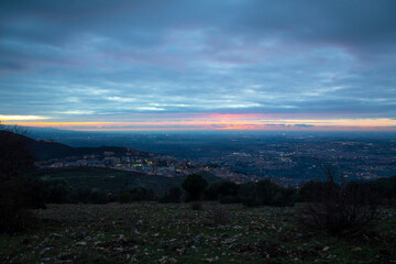 colorful sunset over the city view from the mountain