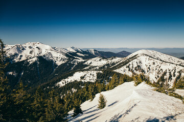 Winter mountains remnants of snow, spring, coniferous forest