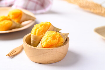 Homemade Toddy palm cake in wooden bowl on white background, Thai traditional dessert