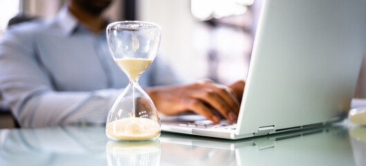 Financial Deadline And Hourglass In Office