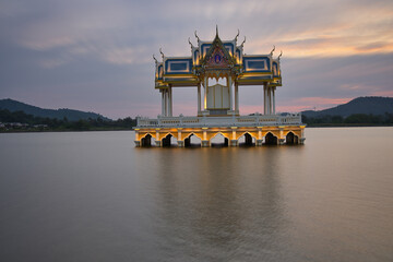 Buddhist Shrine On A Lake In Hua Hin In Thailand At Sunset! The Temel is reflected in the water and the sky turns red!