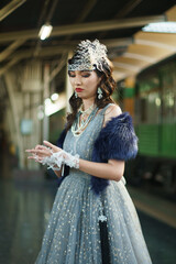 Retro vintage portrait of beautiful Gatsby woman stand look around, wait coming train for lover