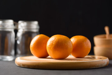 Fresh fruit oranges from local market on black background