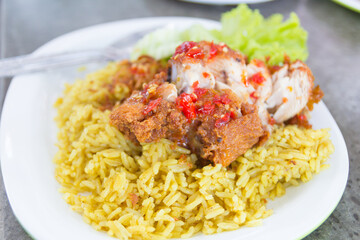 Chicken curry with rice on a table, select focus