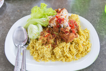 Chicken curry with rice on a table, select focus