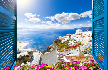 View from an open window with shutters of the sea, coastline and white village of Oia on the island of Santorini, Greece.