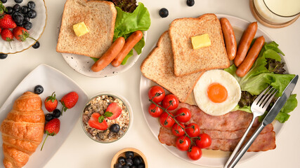 Tasty homemade breakfast set on white dining table.