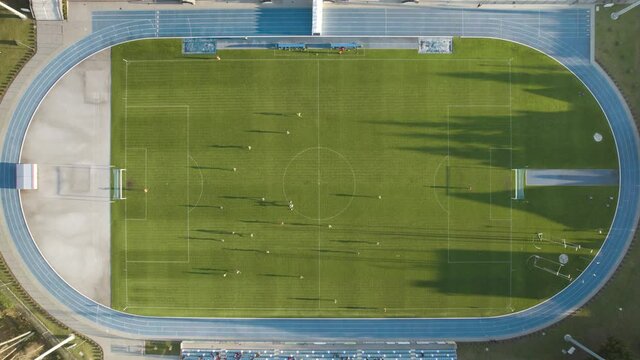 Aerial top-down shot of a soccer field during match