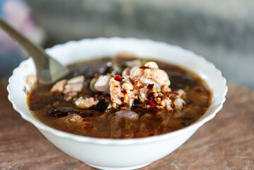 Hot and sour meat soup (Tom Yum) pork or chicken