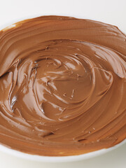 macro photography. Chocolate paste. Delicious high calorie product. Ingredient for cakes, pastries, toasts. Confectionery, supermarket, advertising. There are no people in the photo.