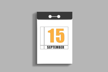 september 15. 15th day of month, calendar date.White page of tear-off calendar, on gray insulated wall. Concept of day of year, time planner, autumn month