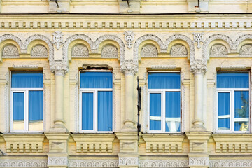 Fragment of old yellow building facade in Kyiv Ukraine