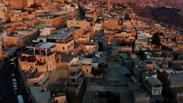 Flying Over Ancient City Of Mardin On A Rocky Hills During Sunset In Turkey. Aerial Drone