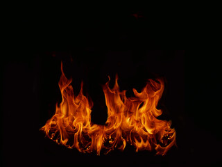 Fototapeta premium Flame Flame Texture For Strange Shape Fire Background Flame meat that is burned from the stove or from cooking. danger feeling abstract black background Suitable for banners or advertisements.