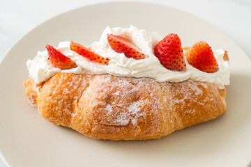 strawberry fresh cream croissant on plate