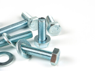 metal bolts and round washers close-up on a white background. copy space