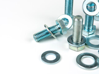 metal bolts and round washers close-up on a white background. copy space