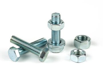 metal bolts and nuts with round washers close-up on a white background