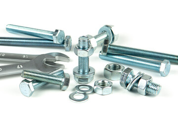 New repair tool, bolts and nuts close-up on a white background. Tool for connecting a threaded...