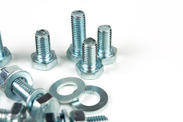 metal bolts and nuts with round washers close-up on a white background. copy space