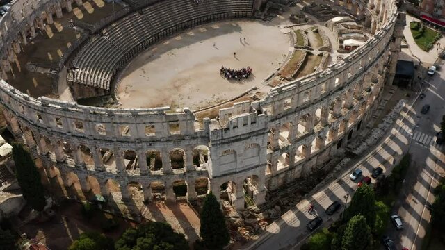 Arena Pula - Ancient Ruins of Roman Amphitheater in Pula, Istria Region of Croatia - aerial drone shot