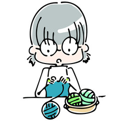 編み物をするメガネっ子の上半身