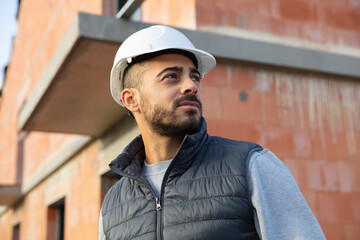 construction project male builder checking new building