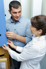 Obraz premium couple in kitchen furniture store