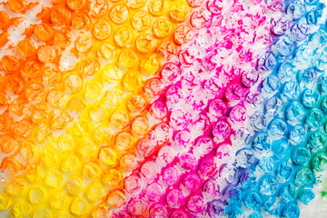 abstract background of colored bubble wrap painted with paint