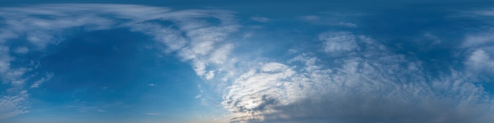 Blue sky panorama with Cirrus clouds in Seamless spherical equirectangular format. Full zenith for use in 3D graphics, game and editing aerial drone 360 degree panoramas for sky replacement.
