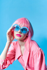 fashionable woman in pink wig pink dress Red lips studio model unaltered