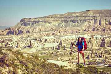 Pedestrian tourism, people travel with backpacks, in the open air.