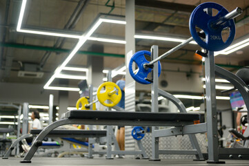 indoors fitness sport gym with exercise equipment with training people