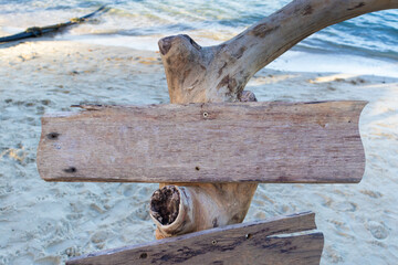 Empty wooden sign on the beach