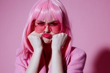 Pretty young female bright makeup pink hair glamor stylish glasses pink background unaltered