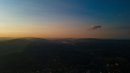 Obraz premium Mountains forest at sunset top view