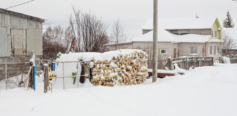village street in winter on a frosty snowy day in Russia