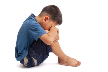  sad boy sittign on white background