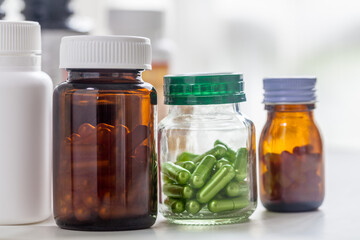 bottle with green pills