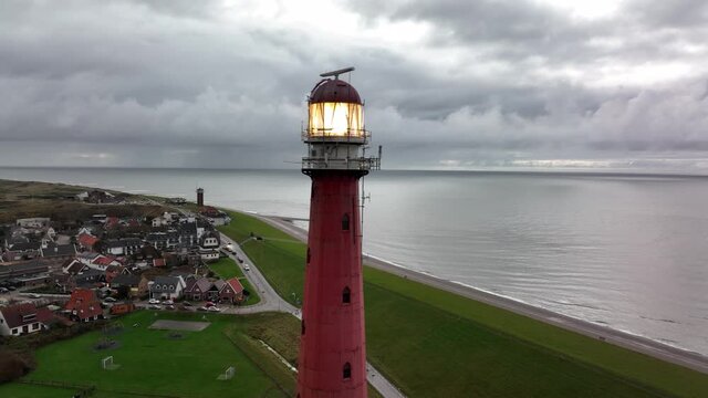 Lighthouse tower Lange Jaap in Den Helder drone aerial footage 5K along the sea near the island of Texel in North Holland, The Netherlands.
