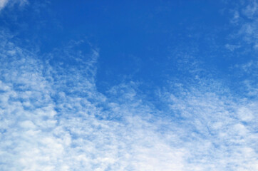 Beautiful White Altocumulus Clouds Scattered on Vibrant Blue Sky